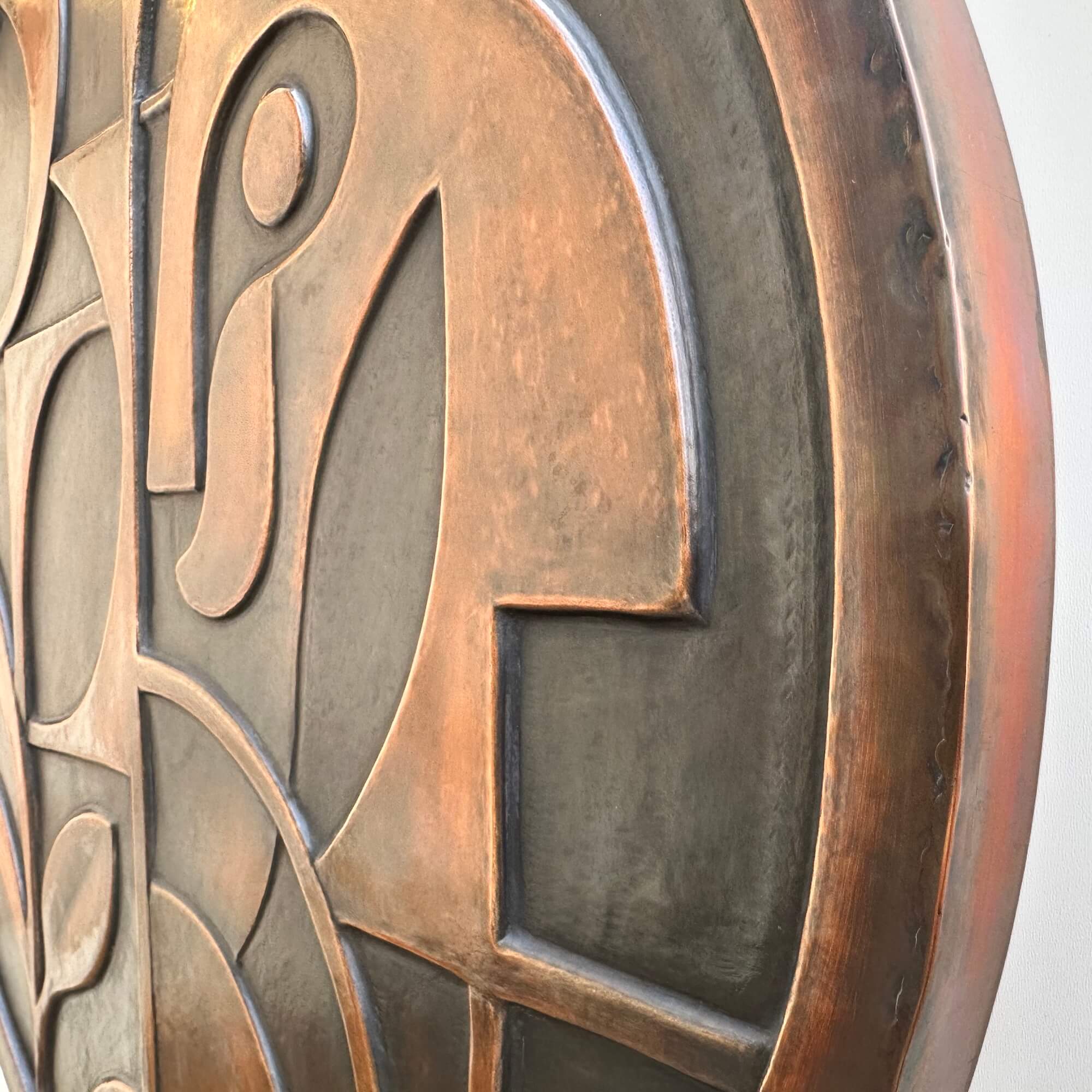 Round abstract metal wall art sculpture close side edge large
