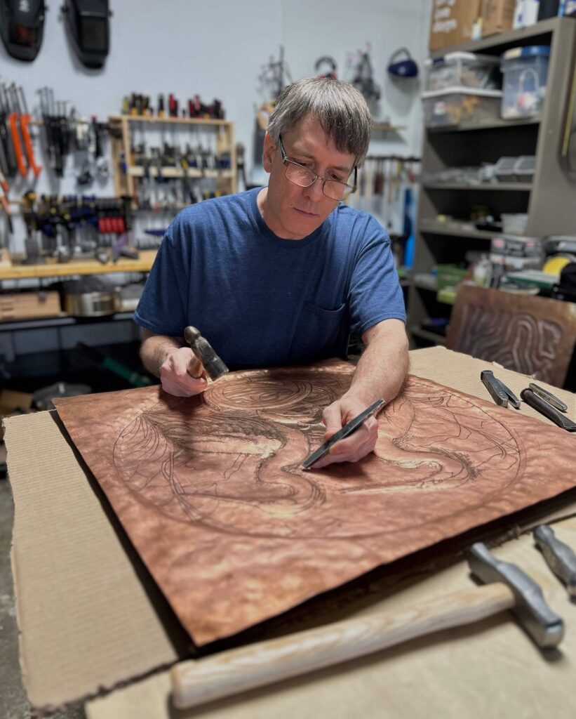 Jeremy Maronpot Artist Element 29 Metalcraft working on copper art